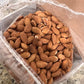 newly opened box full of organic almonds