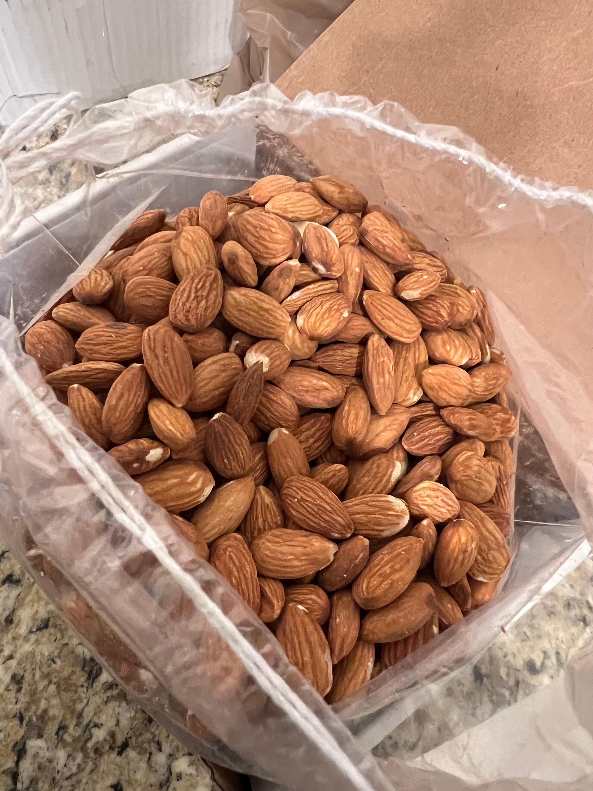 newly opened box full of organic almonds